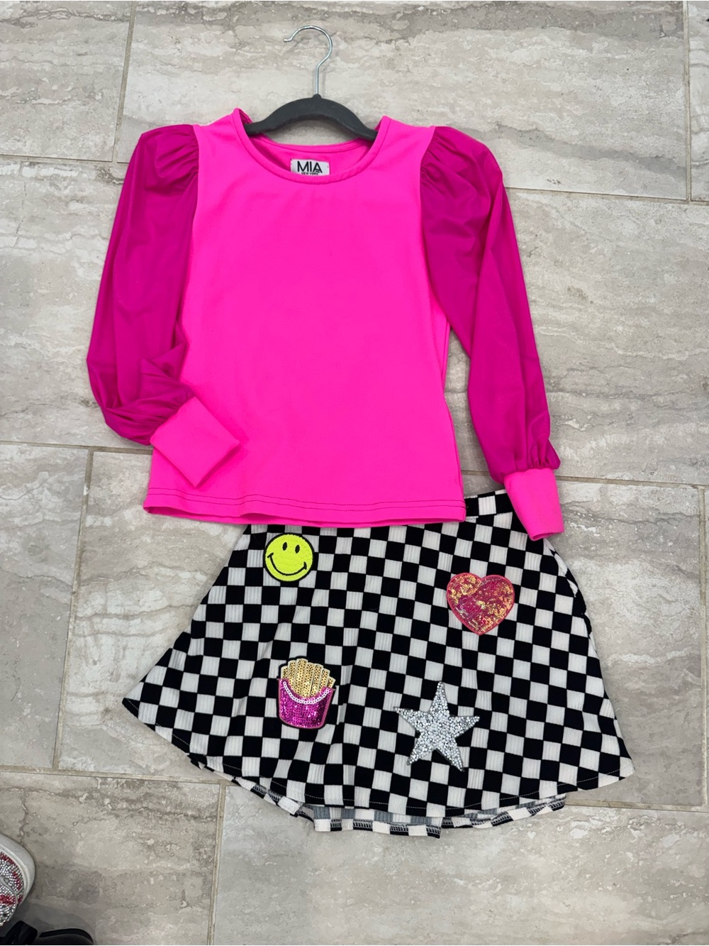 Mia Pink top and check skirt